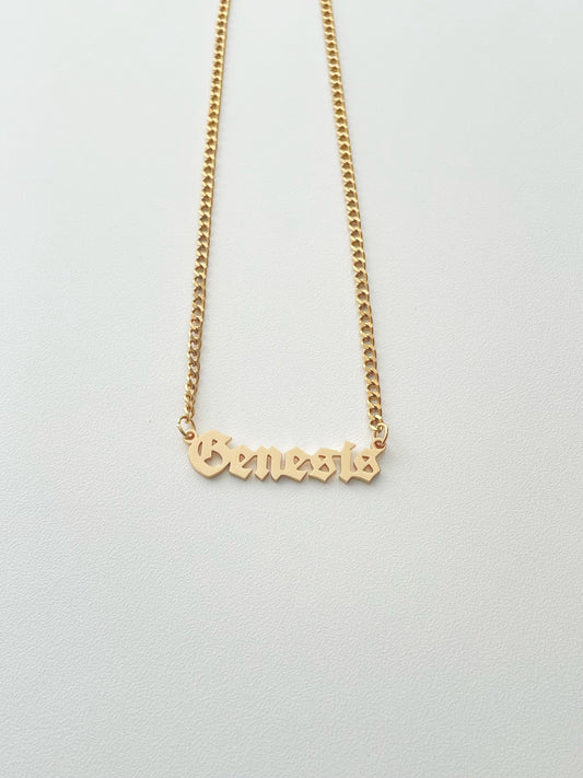 golden Genesis name necklace with goth style font and mini cuba chain